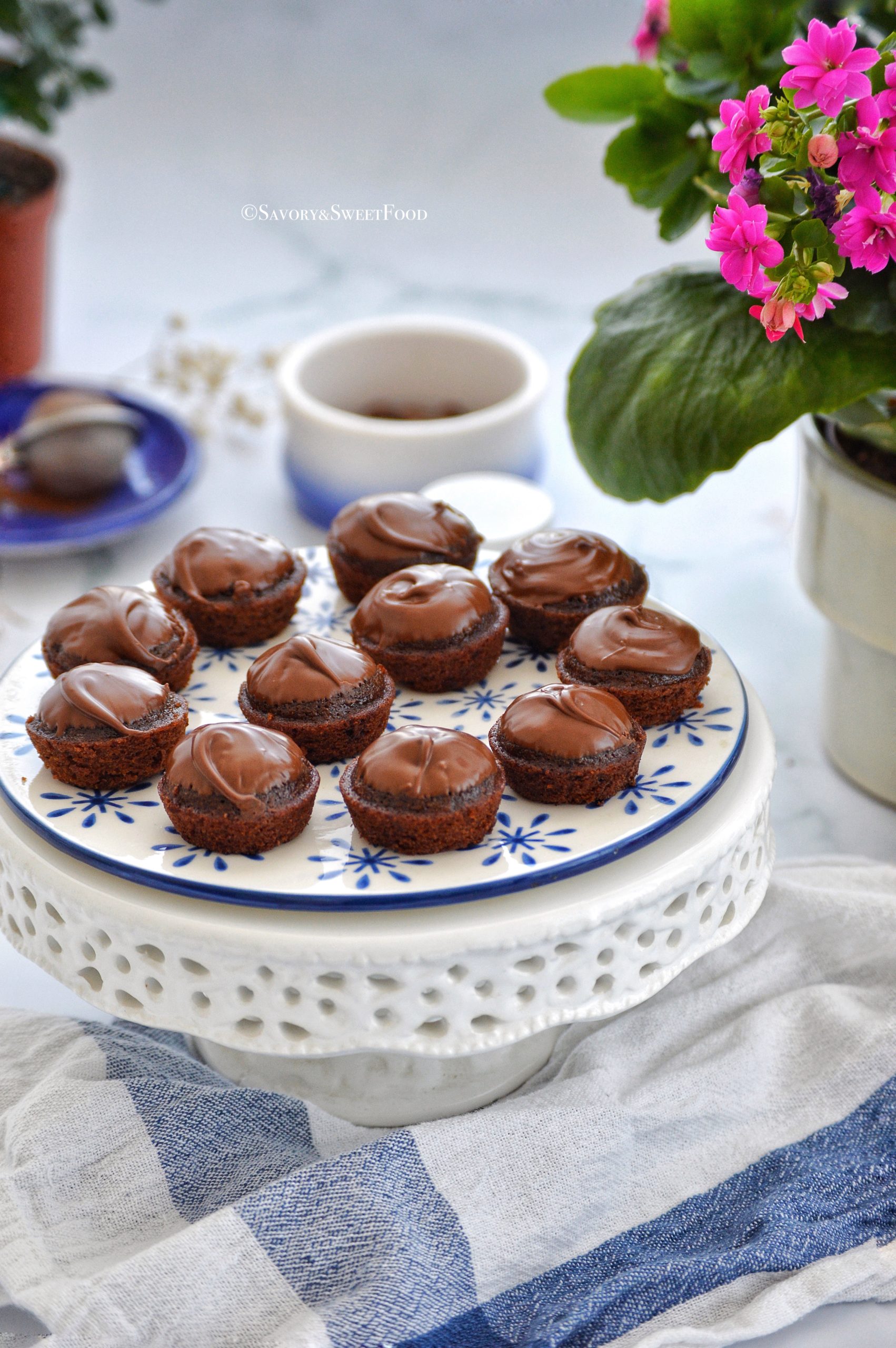 Delicious chocolate cake on white porcelain plate with one bite in spoon  and bars of just opened chocolate beside Stock Photo - Alamy